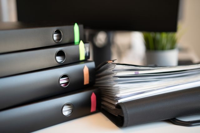a stack of organized binders