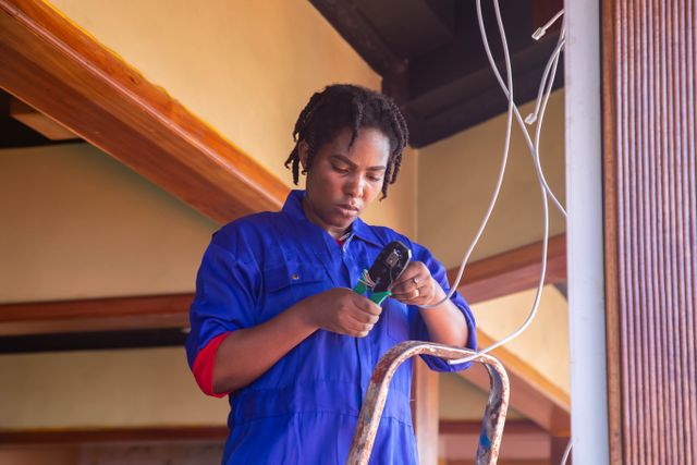 An electrician working on wires in a New Jersey home